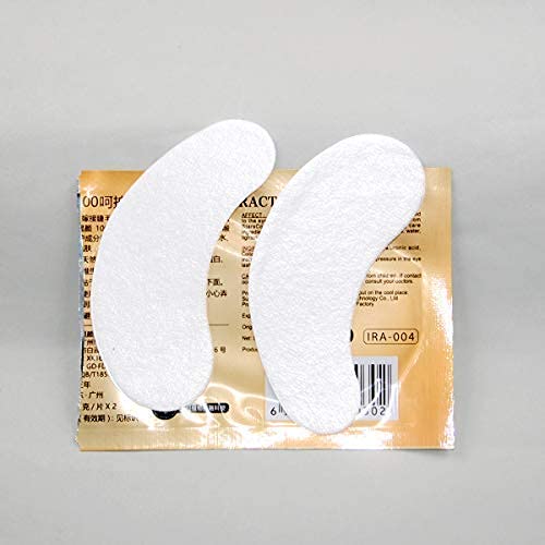 a pair of white pads sitting on top of a piece of paper