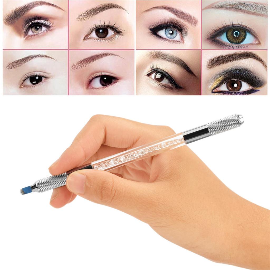 a woman's hand holding a pen with different types of eyes