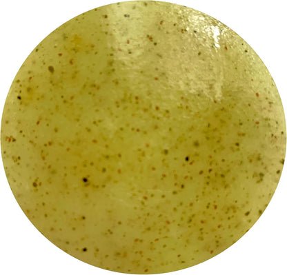 a round yellow object with brown speckles on it