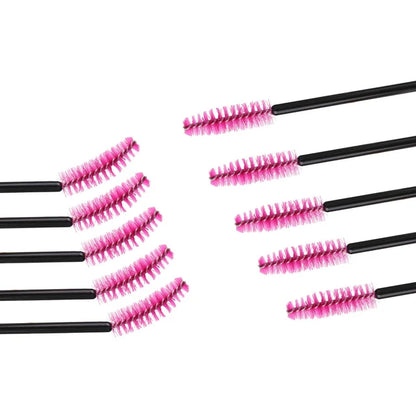 a set of five mascara brushes sitting on top of each other