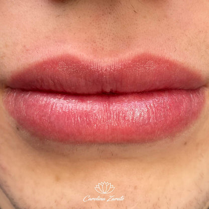 a close up of a woman's lips with pink lipstick