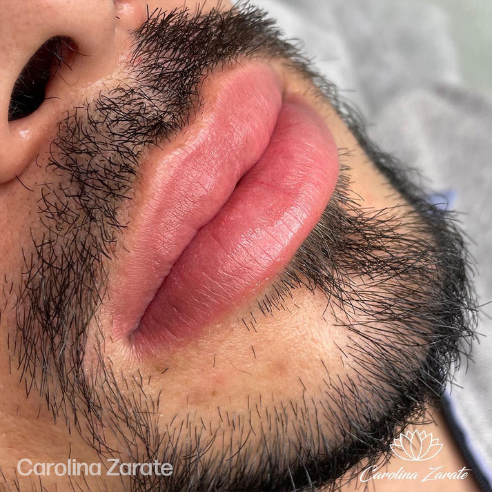 a close up of a man's face with a beard