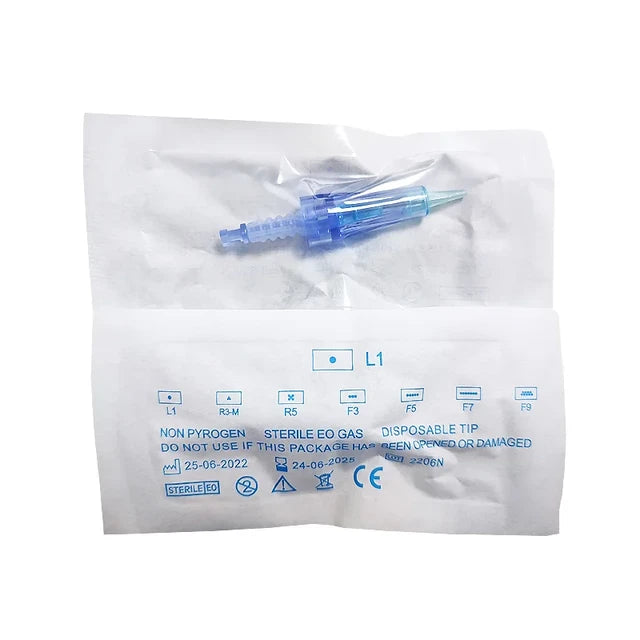 a blue and white toothbrush sitting on top of a plastic bag