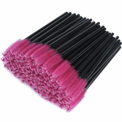 a bunch of pink and black brushes on a white background