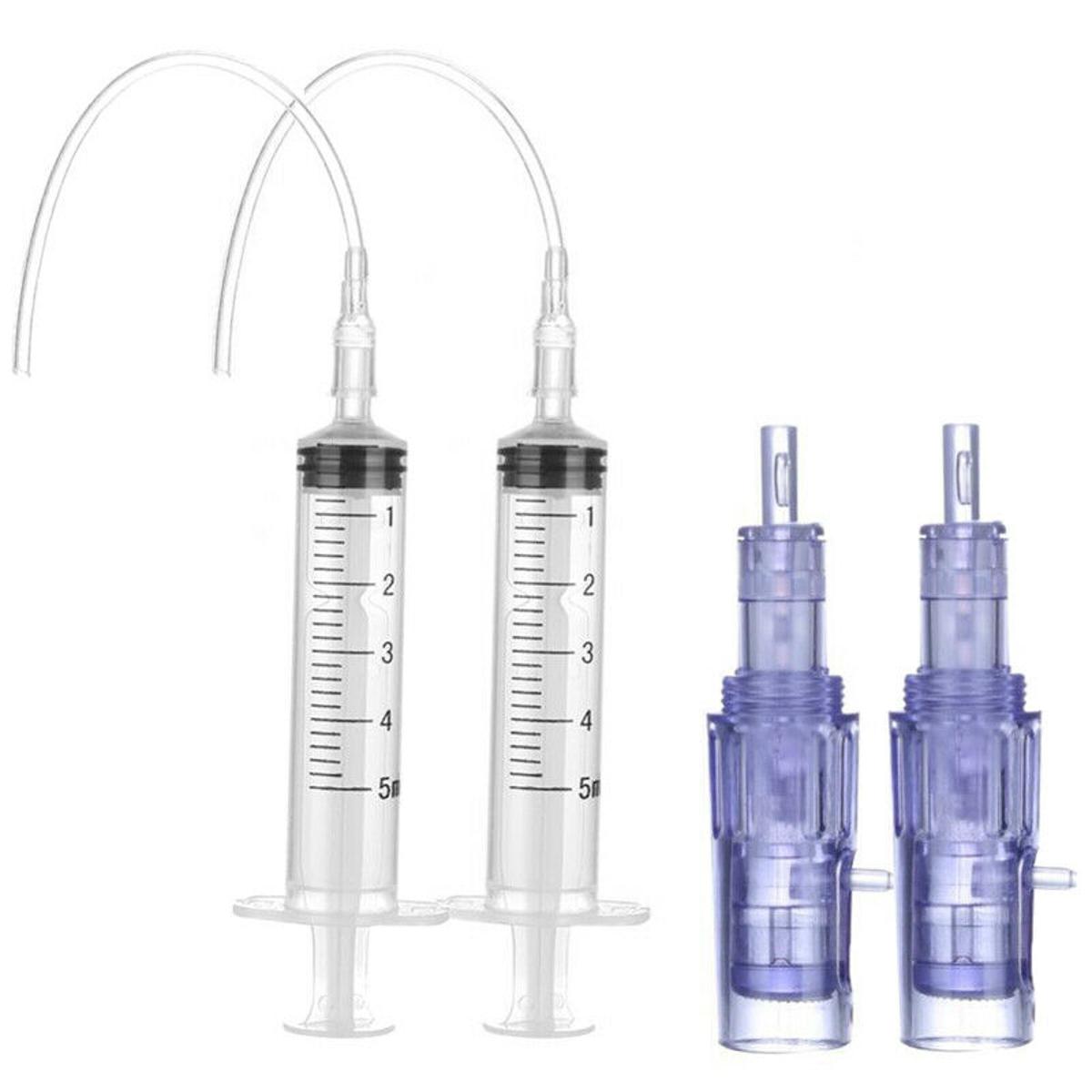 a set of three bottles with a needle attached to them