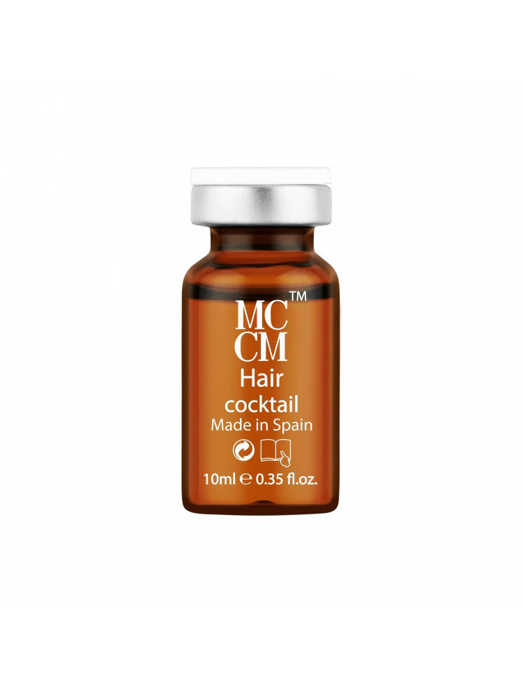 a bottle of mc c m hair oil