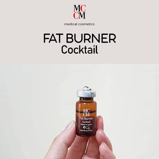 a hand holding a bottle of fat burner cocktail