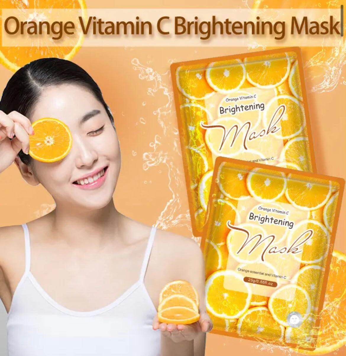 a woman holding up a sheet of brightening mask