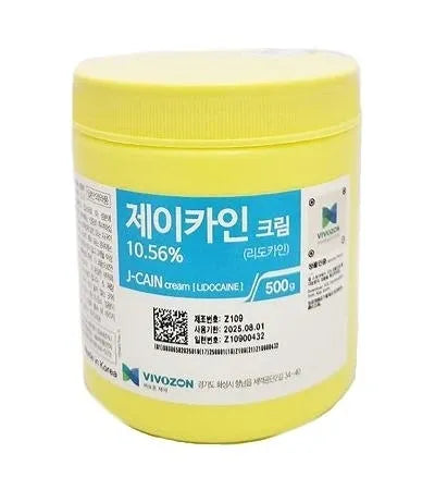 a jar of yellow colored paste on a white background