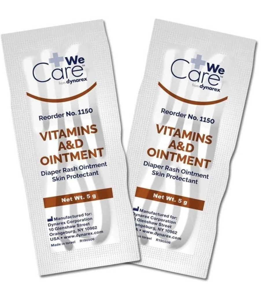 two packets of vitamins and ointment on a white background