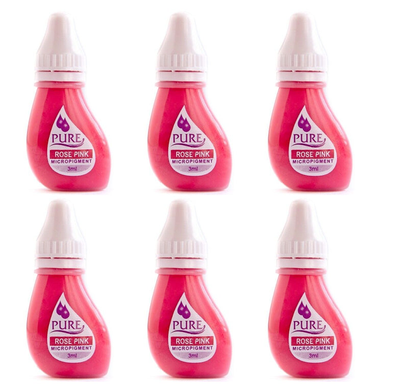 a set of six bottles of pink liquid